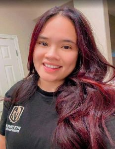 happy client with hair colored burgundy 